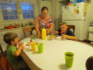 Jane feeding the boys