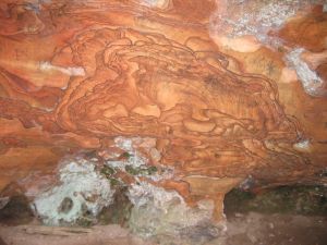 Red rock embedded in wall