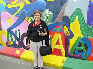 Carolyn at the Berlin Wall